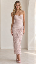 Front full view of woman wearing strapless sweetheart ruched maxi dress in blush pink