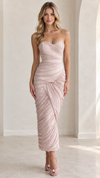 Front full view of woman wearing strapless sweetheart ruched maxi dress in blush pink