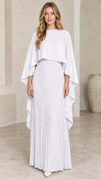 Front view of woman wearing white pleated cape maxi dress