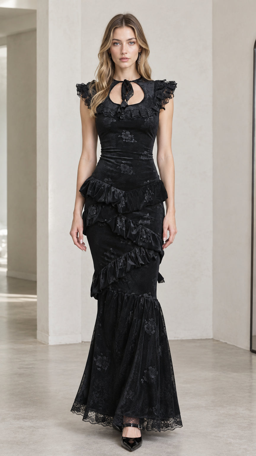 Front full-length view of model wearing black floral jacquard tiered ruffle mermaid evening dress
