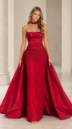 Front view of model wearing a red strapless ruched evening gown with beaded detail and dramatic train