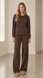 Front full-length view of woman wearing brown ribbed knit cardigan and wide-leg pants set