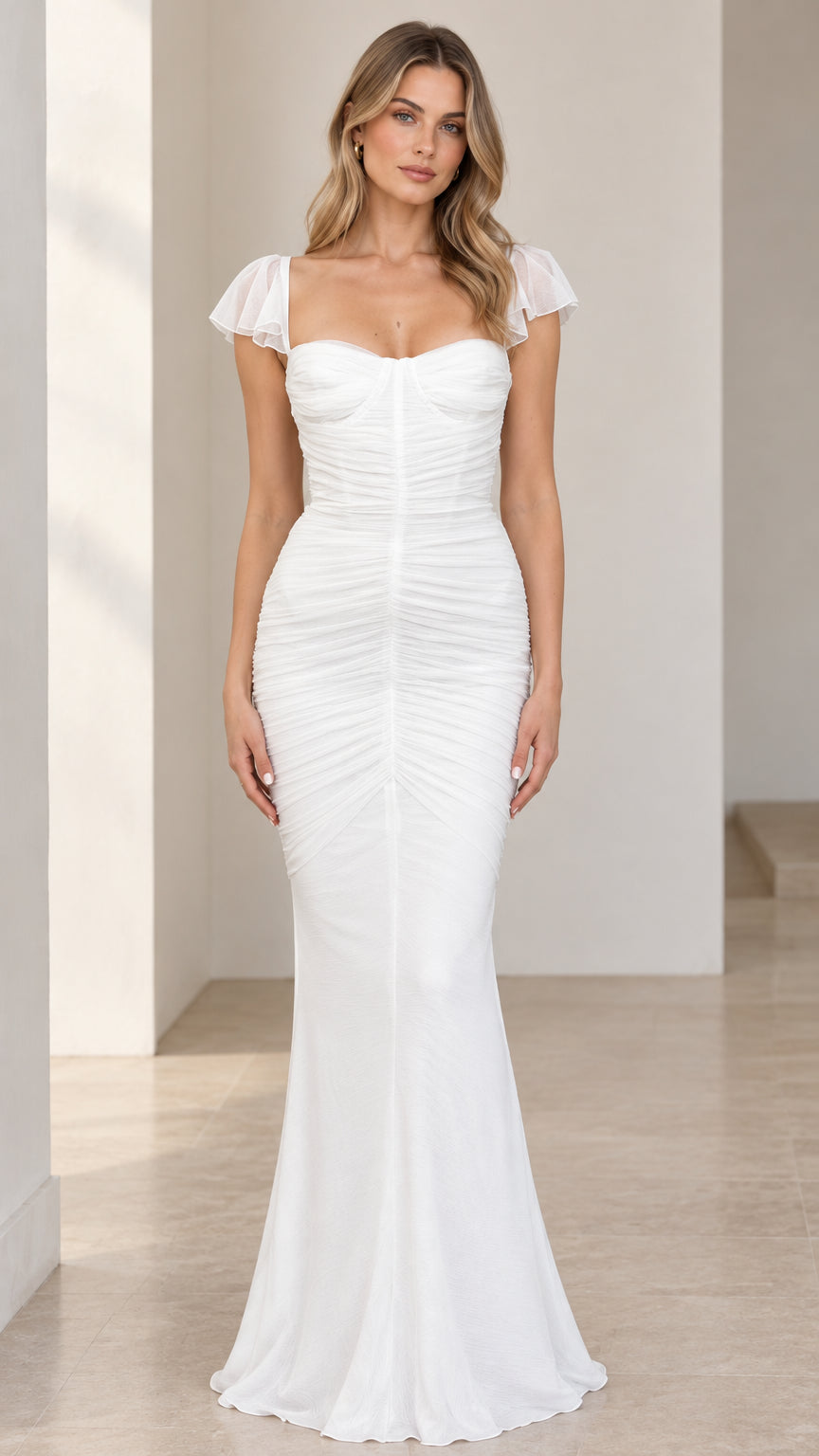Front full-length view of white sweetheart mermaid maxi dress with flutter sleeves