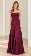 Front full-length view of model wearing burgundy floral lace maxi evening gown with ruched bodice and spaghetti straps