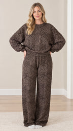 Full front view of model wearing brown snakeskin print long sleeve top and matching wide leg lounge pants