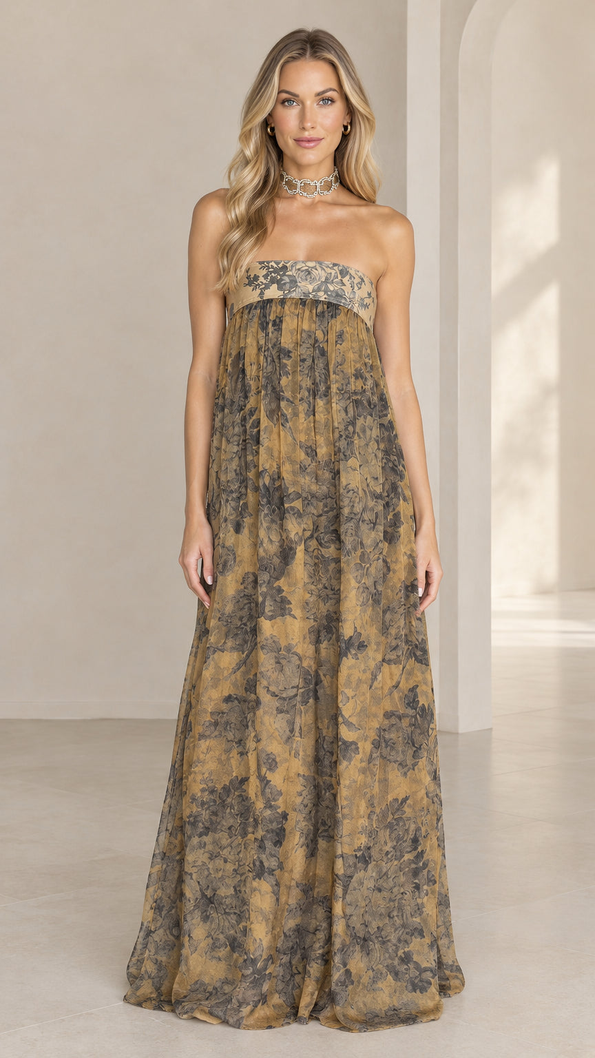 Front full view of woman wearing strapless golden tan floral print empire waist maxi dress