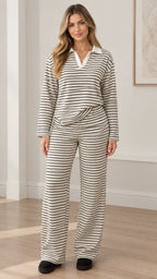 Front full view of woman wearing white striped polo collar top and wide leg pants lounge set