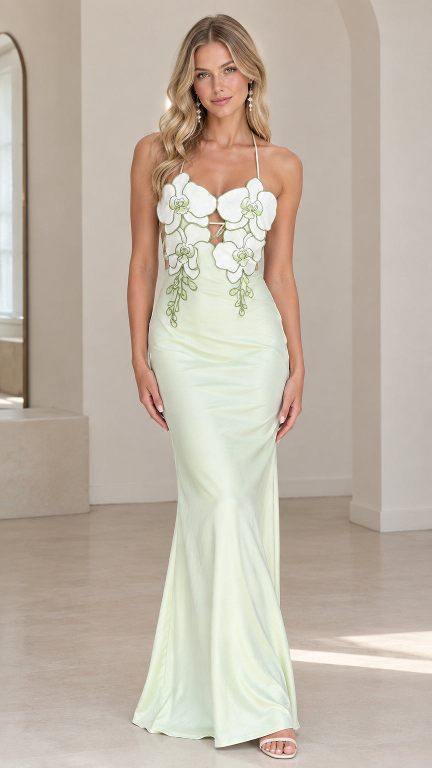 Front view of model wearing sage green floral appliqué halter satin maxi dress