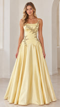 Front view of model wearing pastel yellow embroidered basque waist satin evening gown