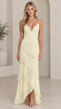 Front view of model wearing pale yellow embellished tiered cami maxi dress