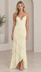 Front view of model wearing pale yellow embellished tiered cami maxi dress