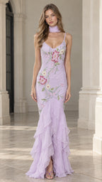 Front view of model wearing lavender floral embroidered mermaid evening gown with tiered ruffle skirt and matching scarf