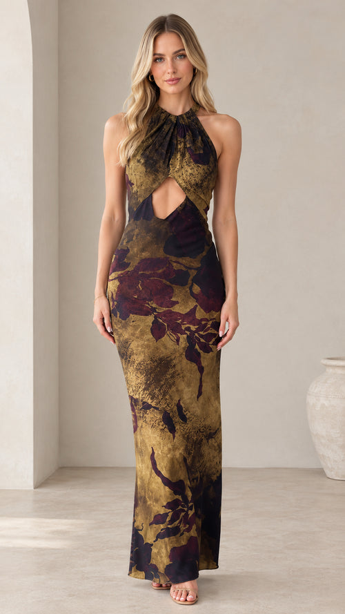 Front full-length view of model wearing olive floral halter cutout maxi dress