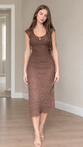 Front view of woman wearing brown textured cap sleeve ring cutout midi bodycon dress