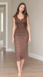 Front view of woman wearing brown textured cap sleeve ring cutout midi bodycon dress