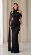 Front view of model wearing black asymmetrical cape neckline ruched maxi dress