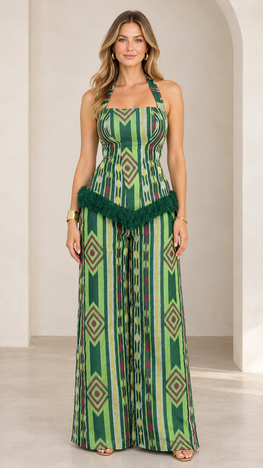 Full front view of green geometric print halter top and wide leg pants set with fringe trim