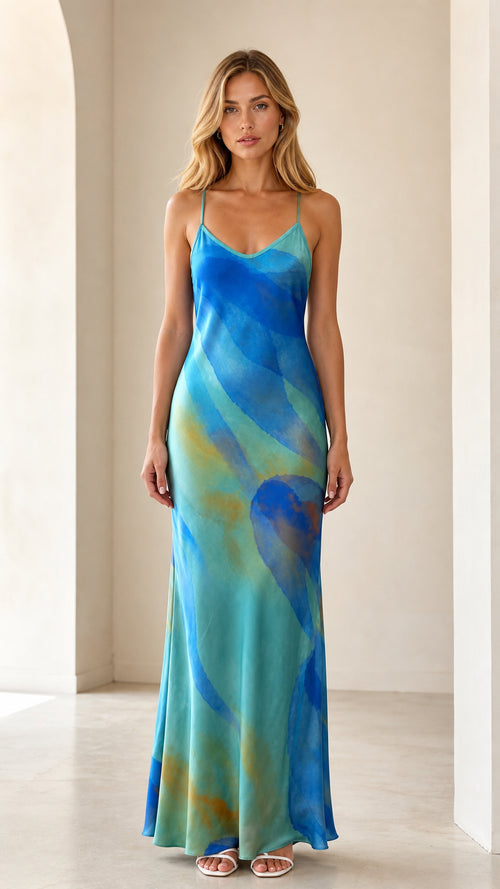 Front view of model wearing aqua blue abstract print satin maxi slip dress