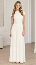 Front full-length view of woman wearing ivory ruched bodice drop-waist maxi dress