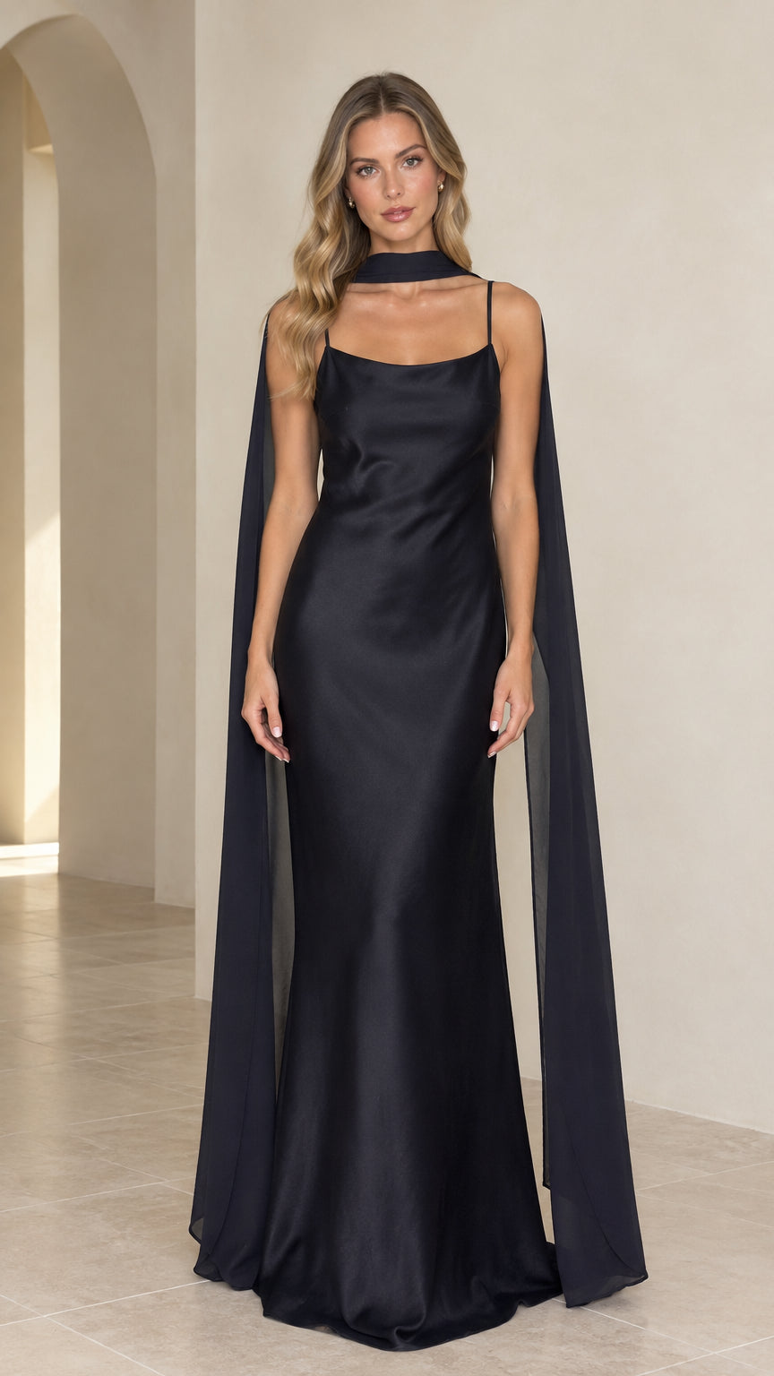 Full front view of black satin sleeveless maxi evening gown with matching neck scarf cape