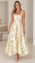 Front view of model wearing champagne sleeveless square neck disc sequin A-line maxi dress