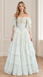 Front view of woman wearing light mint green off-the-shoulder corset tiered ball gown