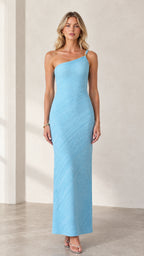 Front full-length view of model wearing light blue one-shoulder textured maxi column dress