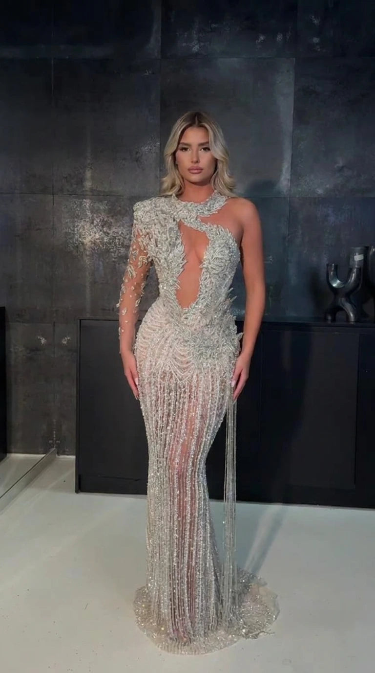 Front view of silver one-shoulder cutout sequin evening gown