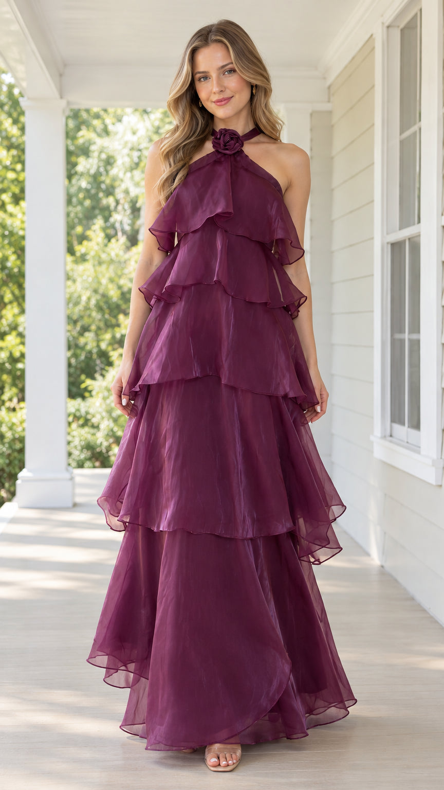 Front view of model wearing burgundy halter neck tiered maxi dress with rosette collar