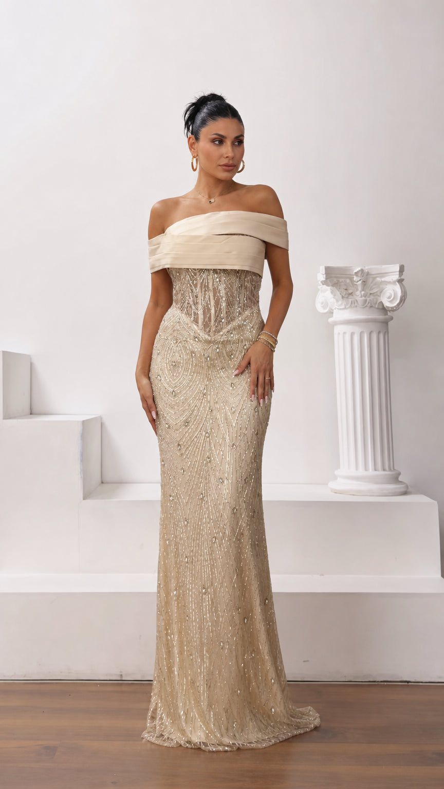 Front full-length view of model wearing champagne gold off-the-shoulder beaded corset evening gown