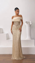 Front full-length view of model wearing champagne gold off-the-shoulder beaded corset evening gown