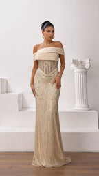 Front full-length view of model wearing champagne gold off-the-shoulder beaded corset evening gown