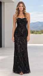 Front view of model wearing black strapless sweetheart beaded lace column evening gown
