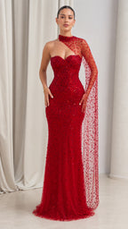 Front view of model wearing red asymmetrical beaded cape sleeve evening gown