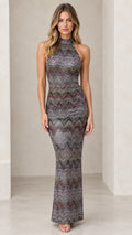 Model wearing multicolor metallic chevron halter maxi dress front view