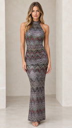 Model wearing multicolor metallic chevron halter maxi dress front view