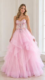 Front view of woman wearing a pink strapless tiered tulle ball gown with beaded bodice