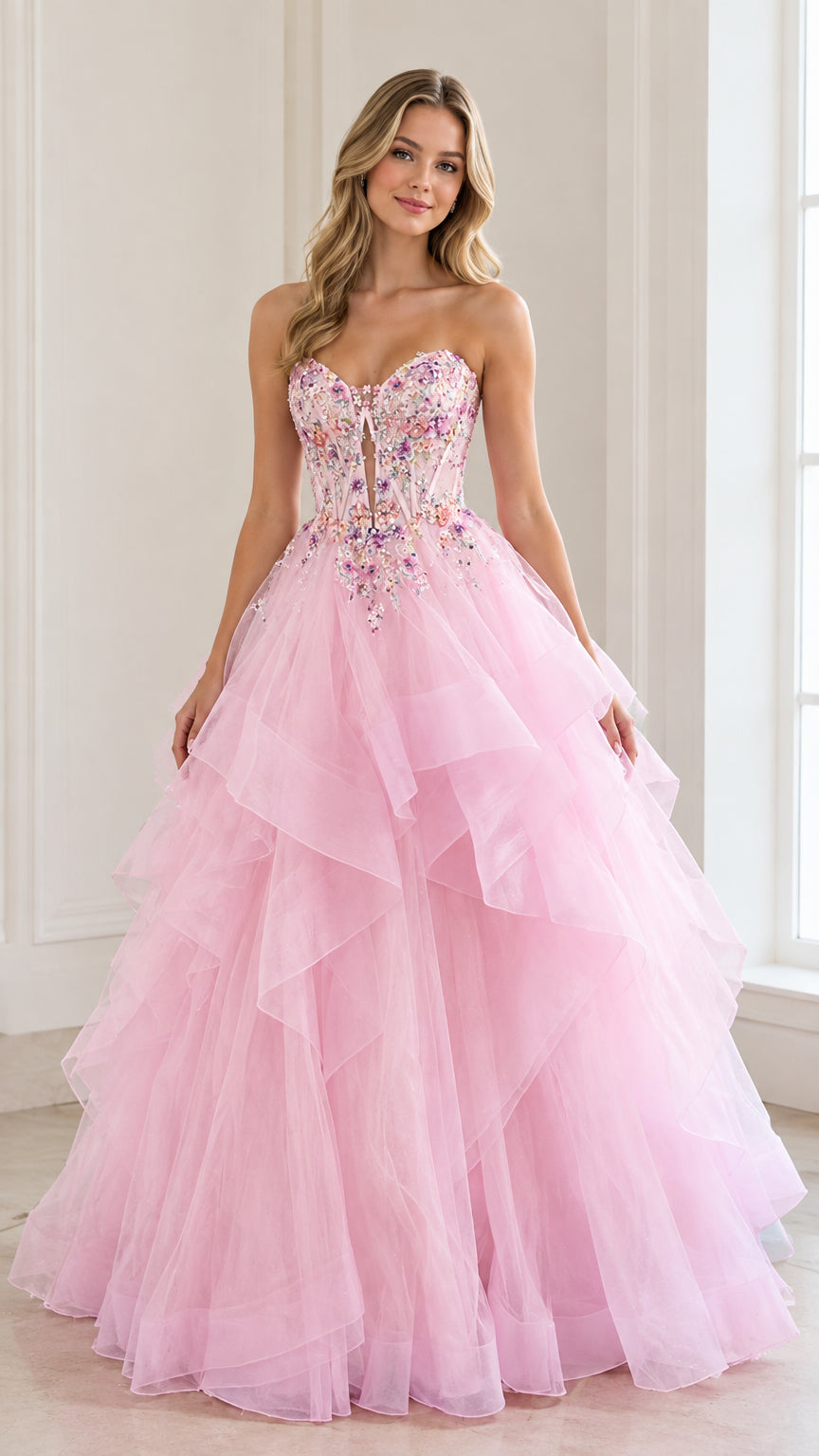 Front view of woman wearing a pink strapless tiered tulle ball gown with beaded bodice