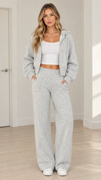 Front view of model wearing heather grey zip-up cropped hoodie and wide-leg lounge pants set