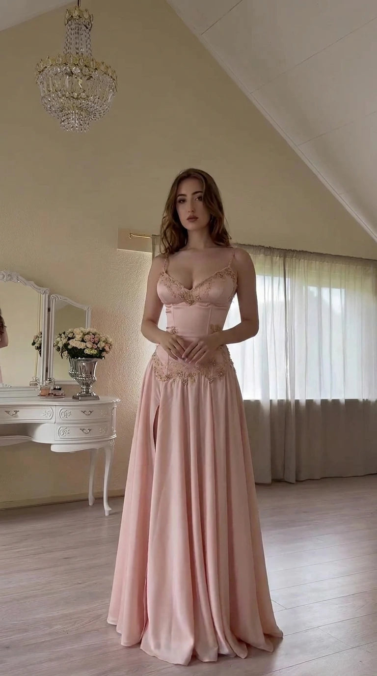 Front view of model wearing pink corset satin maxi evening dress with gold embroidery