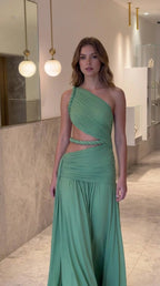 Model wearing the sage green one-shoulder pleated cutout maxi evening gown front view
