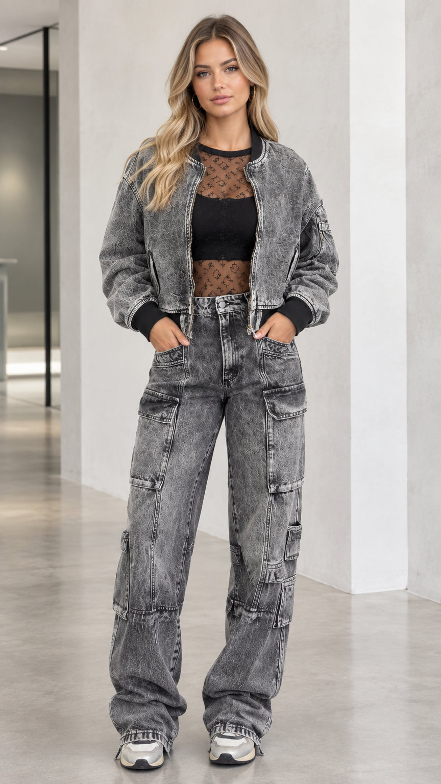 Front view of model wearing washed charcoal denim cropped bomber jacket and wide-leg cargo pants set