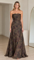 Front view of woman wearing strapless olive floral maxi gown