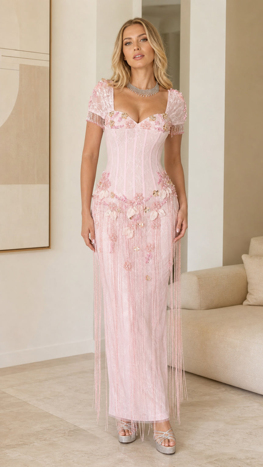 Front view of model wearing Light Pink floral beaded fringe corset maxi dress