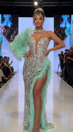 Front runway view of silver sequin evening gown with mint green feather sleeve and slit trim