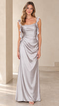 Front full-length view of model wearing a silver ruffled strap ruched satin maxi dress