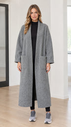 Front full-length view of model wearing grey textured bouclé long open front duster coat