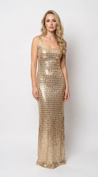 Front view of model wearing gold square neck sequin grid maxi column evening gown