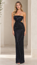 Front view of model wearing a floor-length strapless black sequin evening gown with side cutouts