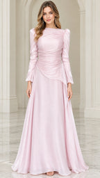 Front view of woman wearing blush pink long sleeve ruched evening gown with beaded waist accent